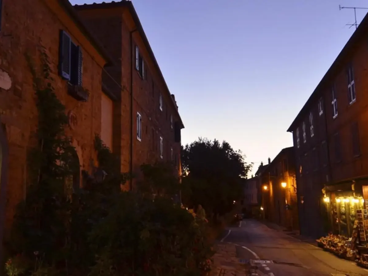 An evening walk in the narrow streets of a medieval village in tuscany